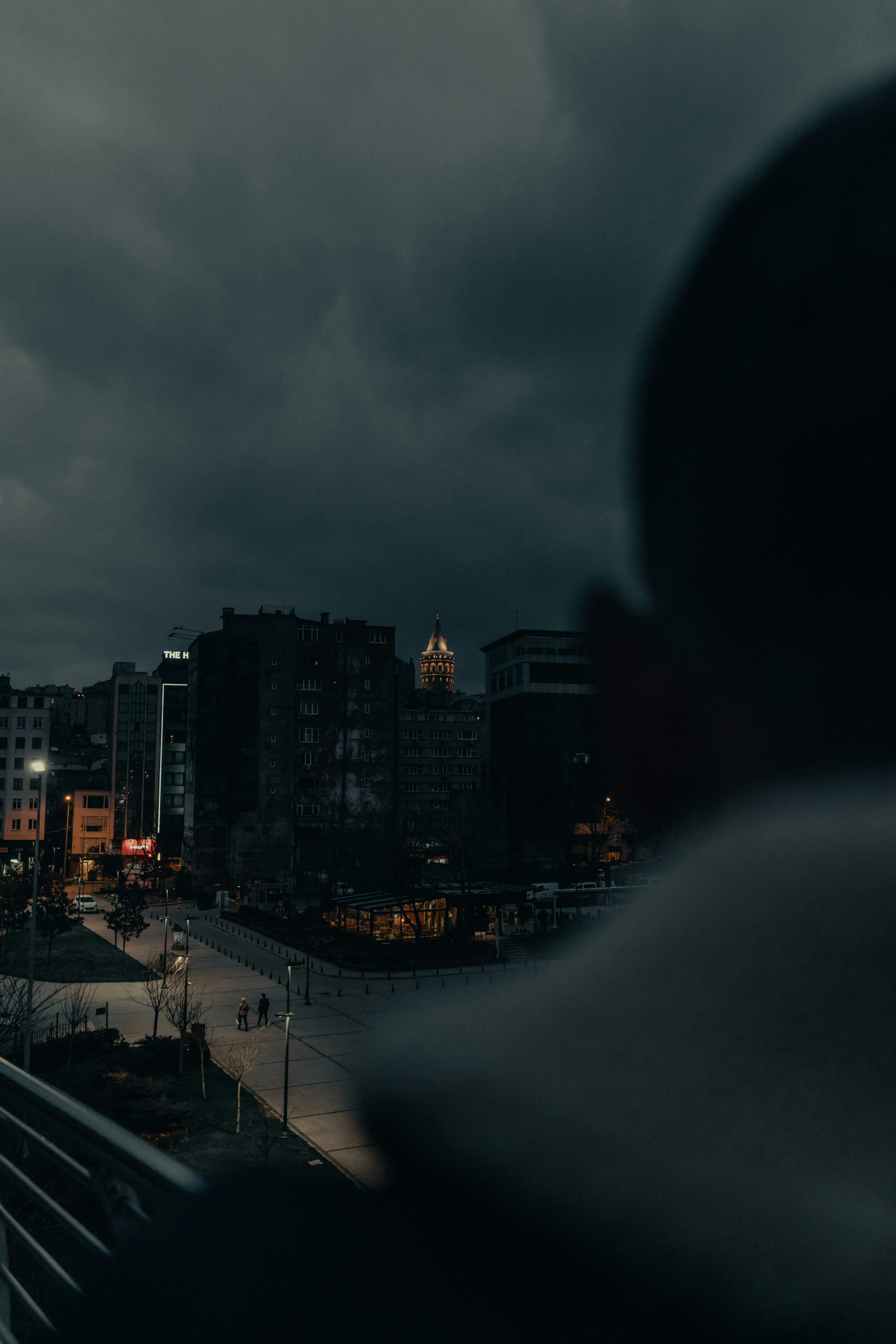 city buildings under gray cloudy sky during daytime